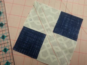 1 large blue square with 2 smaller squares at opposite corners.  Draw a line 1/4" from the middle.